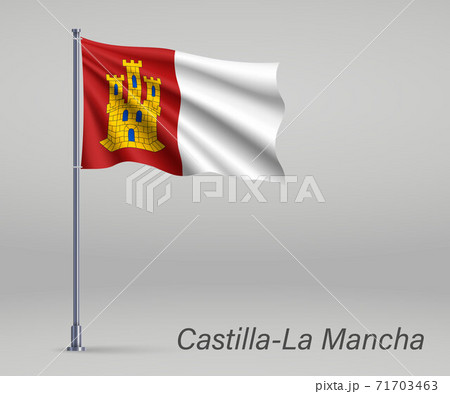 Waving flag of Castilla-La Mancha - region of Spain on flagpole. 71703463