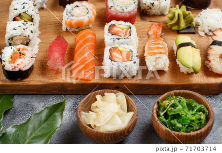 Sushi Set nigiri and sushi rolls on a wooden tray Sushi Set nigiri and sushi rolls on a wooden tray 71703714