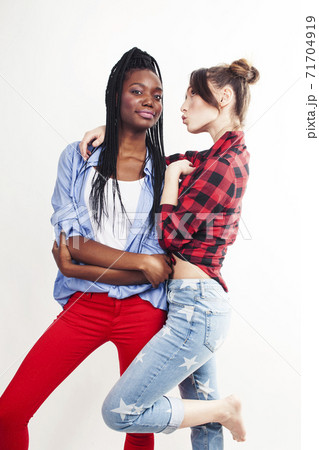 diverse multi nation girls, teenage friends cheerful having fun, happy smiling, cute posing isolated on white background, lifestyle people concept, african-american and caucasian 71704919