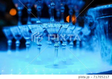 alcoholic cocktail glasses with cherry close-up 71705217