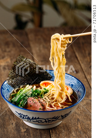 Eating japanese ramen noodle soup with pastrami Eating japanese ramen noodle soup with pastrami 71706513