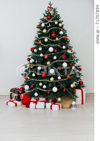 Christmas interior of the Christmas tree pine new year presents a postcard Christmas interior of the Christmas tree pine new year presents a postcard 71707894