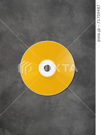 Yellow CD - DVD mockup template isolated on concrete background Yellow CD - DVD mockup template isolated on concrete background 71709487