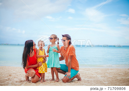 Young family on summer beach vacation Young family on summer beach vacation 71709806