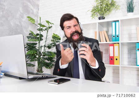 The best coffee in town. Lawyer give thumbs up with coffee cup. 71710062