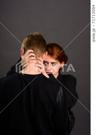 Desparate young woman with aggressive man in studio, domestic violence conception Desparate young woman with aggressive man in studio, domestic violence conception 71713094