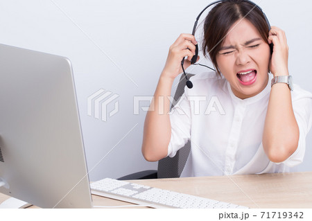 Woman working in call center she feel angry Woman working in call center she feel angry 71719342