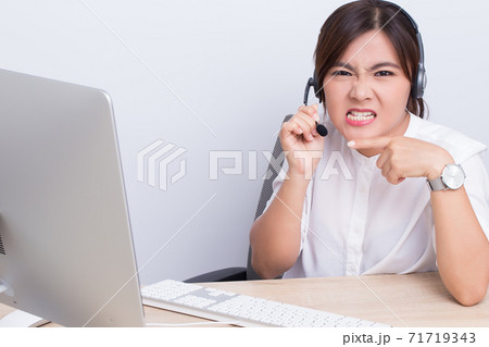 Woman working in call center she feel angry Woman working in call center she feel angry 71719343