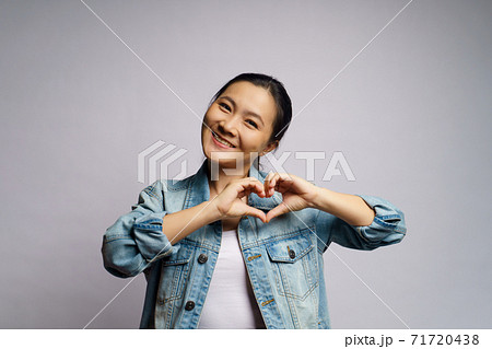 Woman in love making love symbol isolated over white background. Woman in love making love symbol isolated over white background. 71720438