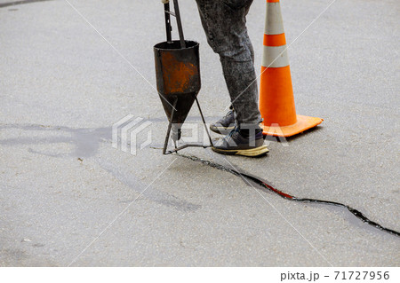 Asphalt seal restoration work filler asphalt crack repair, liquid, joint sealant joint 71727956