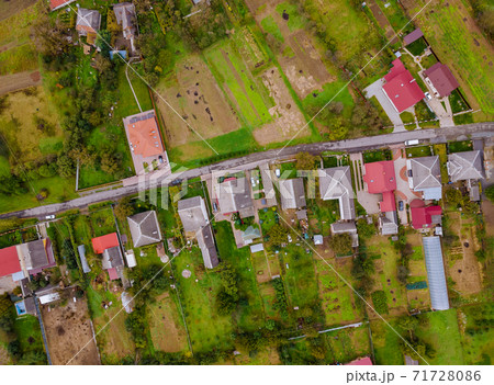 Beautiful of aerial view from a height view of the village with red roofs of a house in European village from a fields 71728086