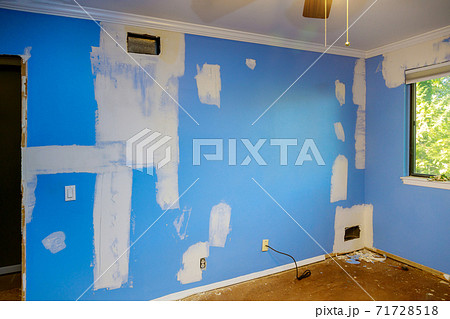 Ceiling and wall with damage spreading plaster to damaged wall, repairing works Ceiling and wall with damage spreading plaster to damaged wall, repairing works 71728518