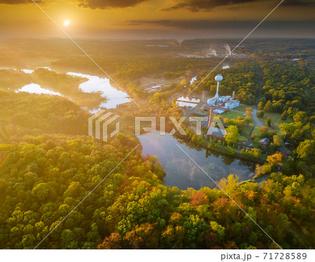 Dramatic soft a beautiful morning autumn fog sunrise pink violet orange clouds against blue sky 71728589