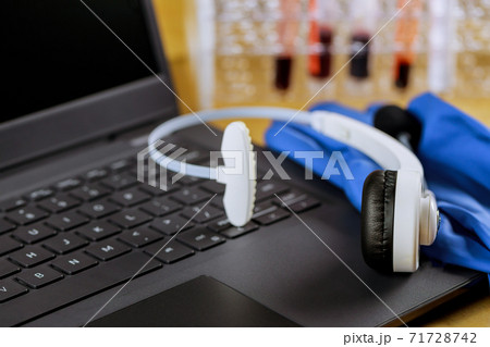 Office of hospital in laboratory working on computer medical staff at blood test Office of hospital in laboratory working on computer medical staff at blood test 71728742