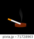 A smoking cigarette in an ashtray on a black background. 71728963
