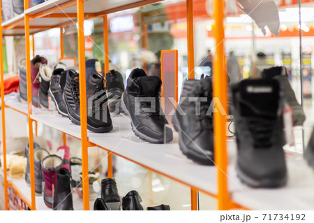 Variety of casual male shoes in the shop display Variety of casual male shoes in the shop display 71734192