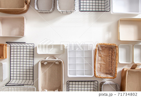 Top view of closet organization boxes and steel wire baskets in different shapes. Top view of closet organization boxes and steel wire baskets in different shapes. 71734802