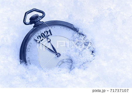 New Year 2021 greeting card, 2021 new year, pocket watch in snow, happy new year concept New Year 2021 greeting card, 2021 new year, pocket watch in snow, happy new year concept 71737107