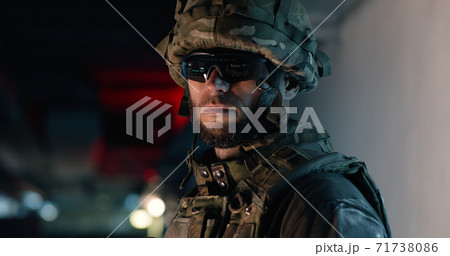 Soldier in hi tech goggles during military mission Soldier in hi tech goggles during military mission 71738086