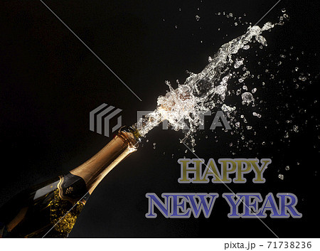 Happy new year theme with splashing champagne Happy new year theme with splashing champagne 71738236