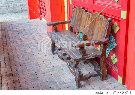 Comfortable wooden bench in the city park 71738813