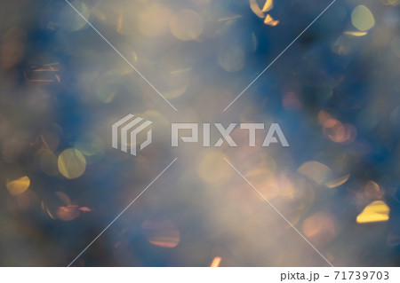 Abstract blurred gold background with beautiful bokeh effect. Abstract blurred gold background with beautiful bokeh effect. 71739703