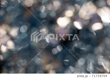 Abstract blurred gold background with beautiful bokeh effect. 71739704