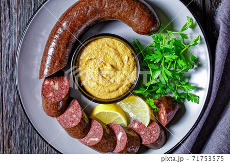 Blutwurst or german blood sausage on a plate Blutwurst or german blood sausage on a plate 71753575