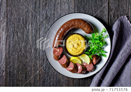 Blutwurst or german blood sausage on a plate Blutwurst or german blood sausage on a plate 71753576