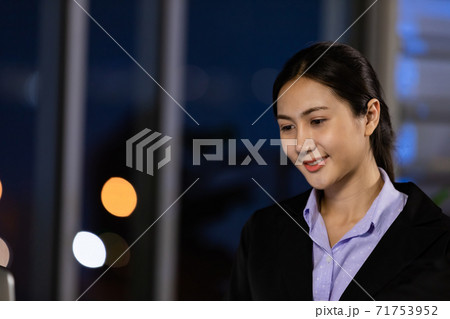 Portrait business young woman working overtime late at night. Portrait business young woman working overtime late at night. 71753952