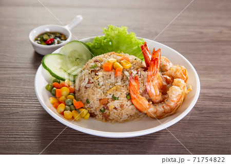 chinese fried rice with barbecue prawn on wooden table 71754822