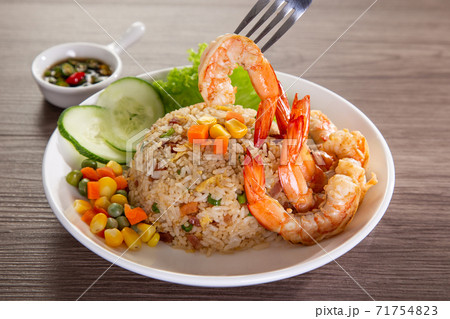 chinese fried rice with barbecue prawn on wooden table 71754823