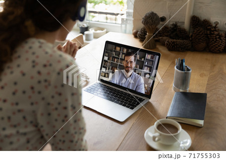 Woman have webcam digital meeting with colleague Woman have webcam digital meeting with colleague 71755303