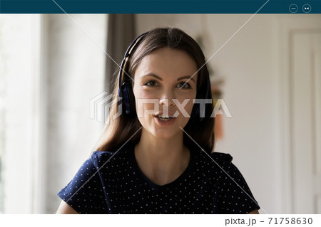 Confident young caucasian woman holding web camera call. 71758630