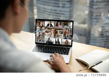 Happy multiracial young people communicating online distantly. Happy multiracial young people communicating online distantly. 71759896