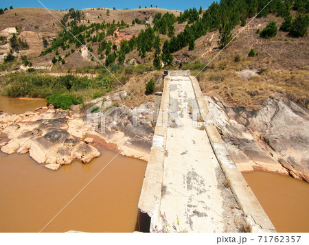 water flow of the Mania river near rice terraces in central Madagascar 71762357