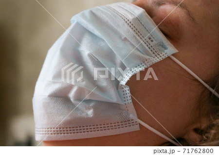 Woman use Health mask to prevent germs, corona virus, Face Mask Covid 19. 71762800