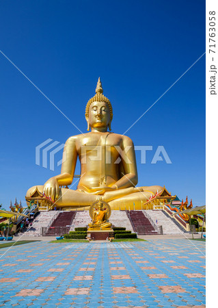 Golden Buddha with clear sky 71763058