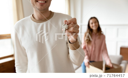 Excited husband happy family show keys to own home Excited husband happy family show keys to own home 71764457