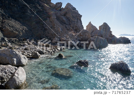 Sea shore with rocks and transparent clear sea water. Sea shore with rocks and transparent clear sea water. 71765237