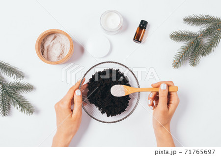 Top view process woman's hands making homemade cosmetic coffee scrub 71765697