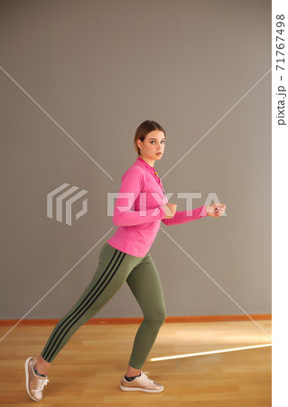 Side view of active sporty young running woman runner athlete with copy space concept sport health fitness loss weight cardio training jog workout wellness. 71767498