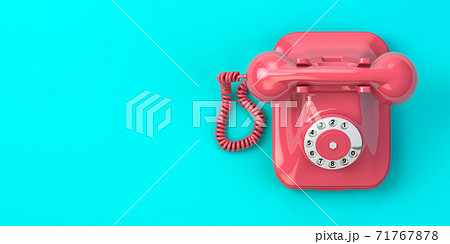 Pink vintage rotary telephone on mint green background. 71767878