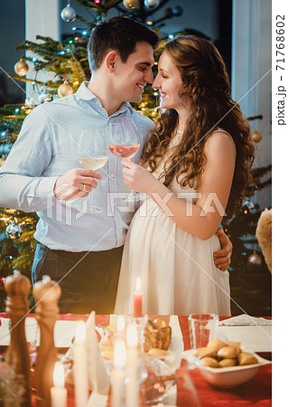 Couple celebrating Christmas, the wife is pregnant Couple celebrating Christmas, the wife is pregnant 71768602