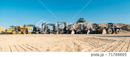 Diggers, excavators and other heavy machines in mine of quarry Diggers, excavators and other heavy machines in mine of quarry 71768605