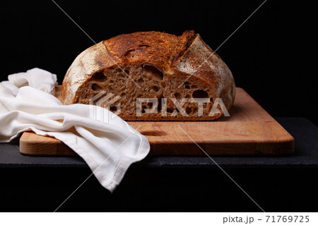 Artisan sourdough bread. on the black background. Artisan sourdough bread. on the black background. 71769725
