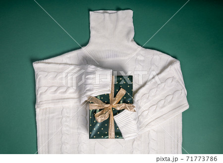 white sweater huging gift box flat lay shape 71773786