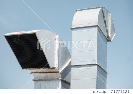 Duct Blower for Air Ventilation Smoke Exhaust Over Roofing of Shopping Mall, Air Ventilations Equipment and Flowing System. Exhausting Air Suction Duct Blower for Air Ventilation Smoke Exhaust Over Roofing of Shopping Mall, Air Ventilations Equipment and Flowing System. Exhausting Air Suction 71775121