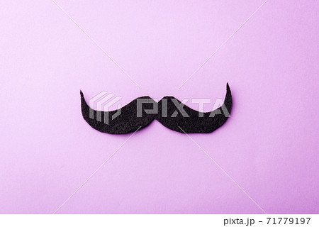 Black mustache paper on purple 71779197