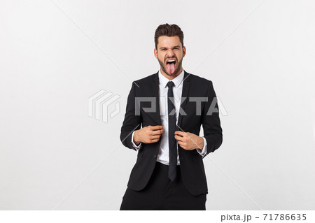 Portrait of a energetic young business man enjoying success, screaming against white - Isolated. 71786635